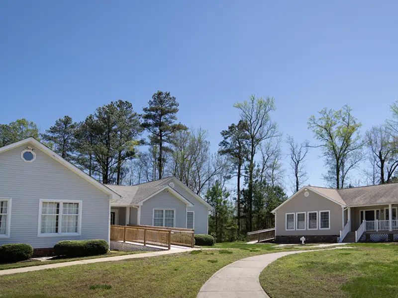 Two cottages representing growth of Good Neighbor Village because of donations.