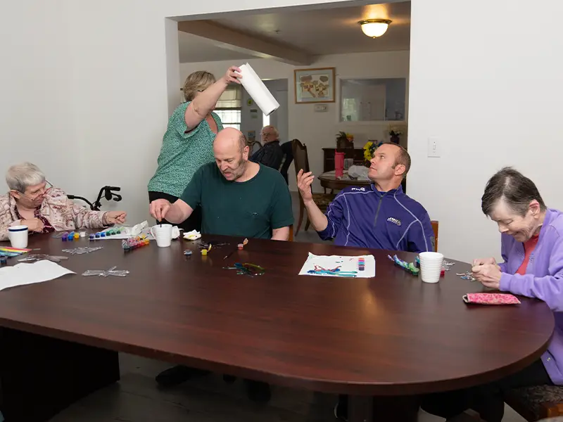 Residents painting and having fun in their cottage