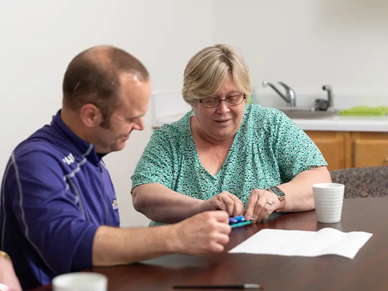 Employee working with resident
