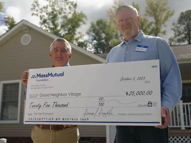 MassMutual presenting check to board member