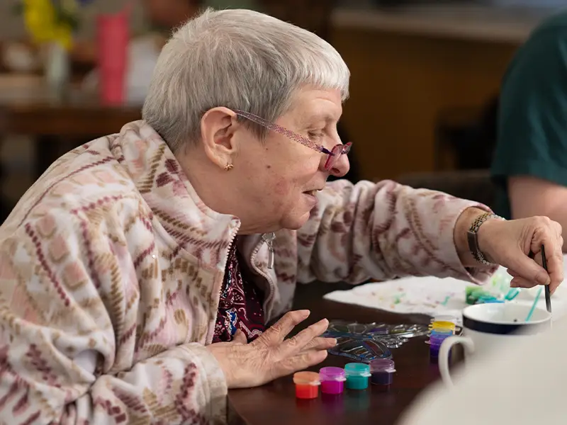 Resident painting independently